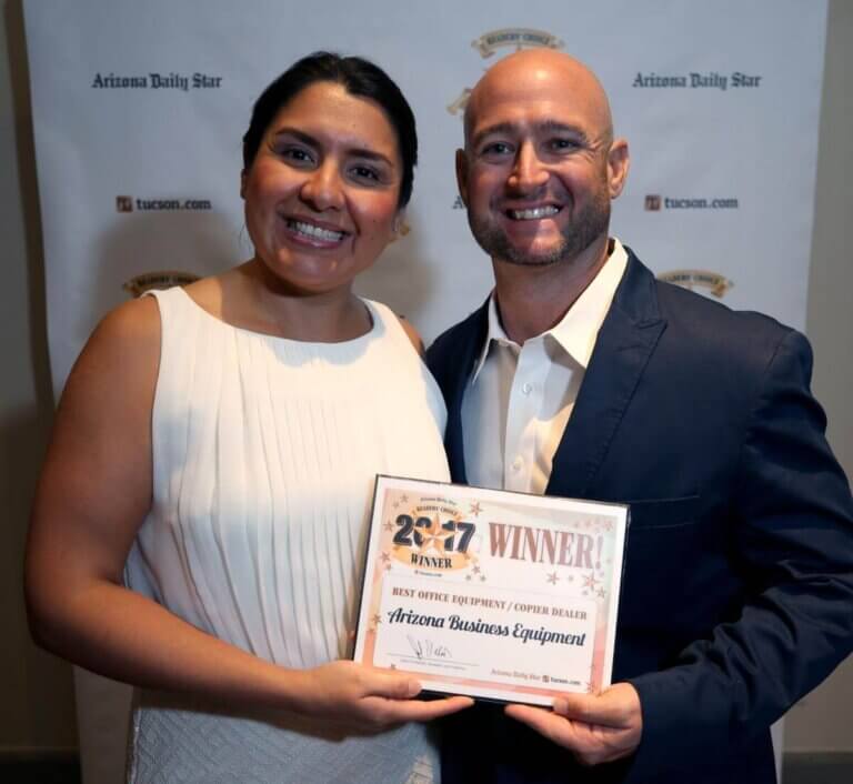 Ericka and Cameron Moore pose with a 2017 Winner certificate.