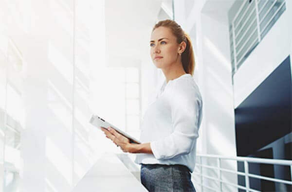 woman holding tablet